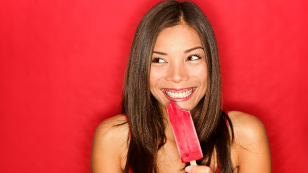 Girl eating popsicle