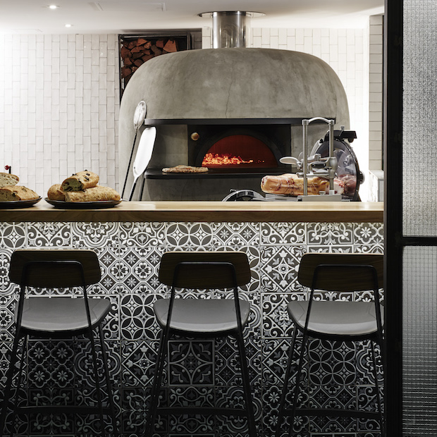 The wood-fire stone oven takes pride of place